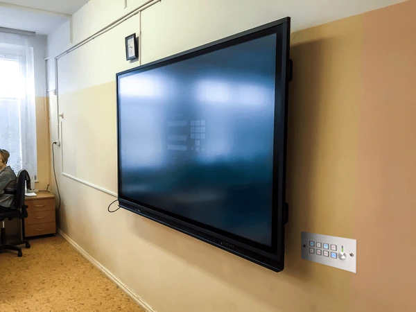 Keypad Controller Panel mounted on classroom wall